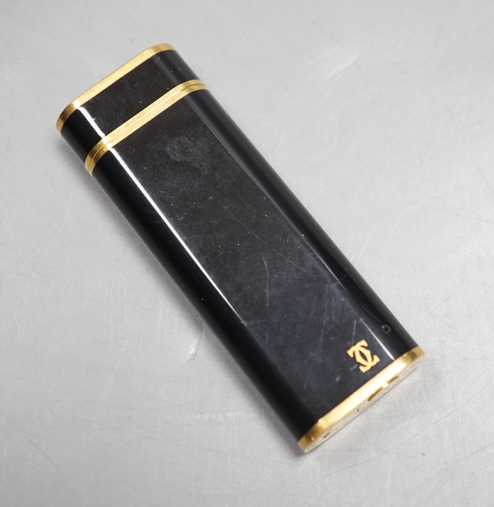 Cartier, black enamel and gold plated lighter